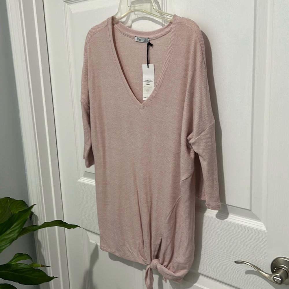NWT very cute drop shoulder top with tie at bottom of waist. Size M